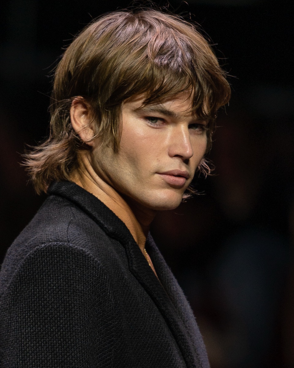 Male model in editorial close-up backstage